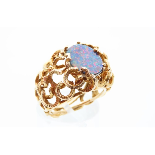 110 - Opal Centre Stone Ring Mounted on 9 Carat Yellow Gold Detailed Band Ring Size M