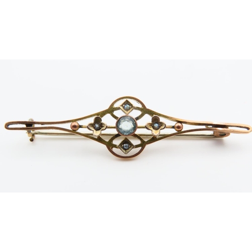 119 - Aquamarine Centre Stone 9 Carat Yellow Gold Bar Brooch with Scroll and Filigree Decoration 5cm Wide