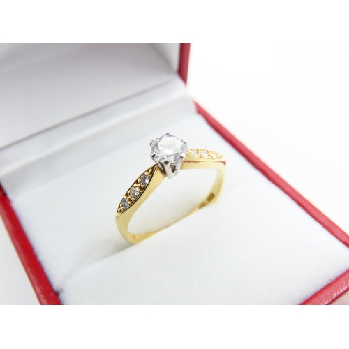 125 - 18 Carat Yellow Gold Diamond solitaire Ring with Three Further Diamonds to Either Shoulder Size L