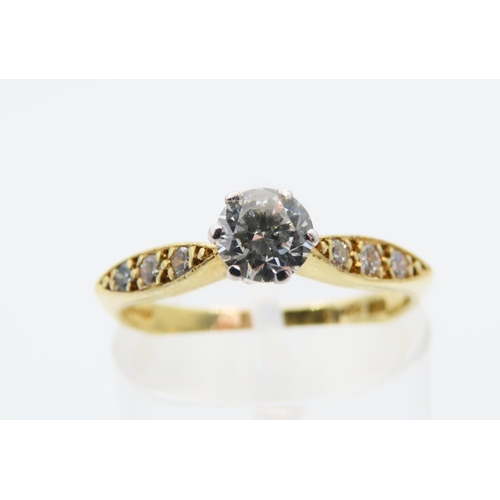 125 - 18 Carat Yellow Gold Diamond solitaire Ring with Three Further Diamonds to Either Shoulder Size L