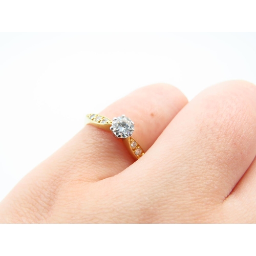 125 - 18 Carat Yellow Gold Diamond solitaire Ring with Three Further Diamonds to Either Shoulder Size L