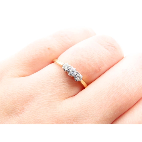 149 - Three Stone Diamond Ring Platinum Set Mounted 18 Carat Yellow Gold Band Ring Size O and a Half