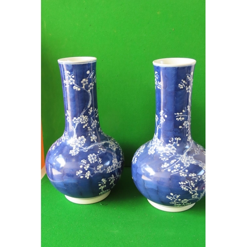 Pair of Oriental Slenderneck Blue Ground Porcelain Vases Decorated with Fairythorn Motifs Each 16 Inches High