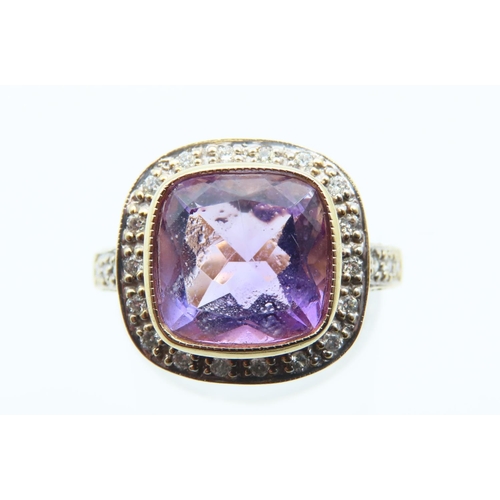 25 - Amethyst and Diamond Ladies Centre Stone Ring Mounted on 18 Carat Yellow Gold Band Further Diamond D... 