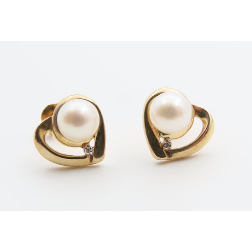 40 - Pair of Pearl Set 9 Carat Yellow Gold Mounted Earrings Each 1cm High