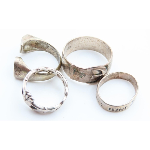 59 - Four Silver Rings Including Torc Form Example and Claddagh Motif Sizes M, J, V and L
