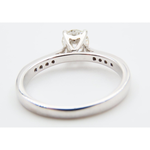 726 - Diamond Solitaire Ring Mounted on 18 Carat White Gold Band Further Inset with Diamonds Ring Size O