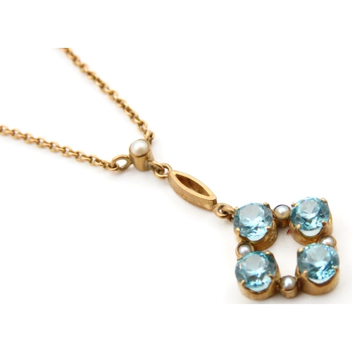 730 - 9 Carat Yellow Gold Blue Topaz Four Stone Set Pendant on 9 Carat Yellow Gold Chain