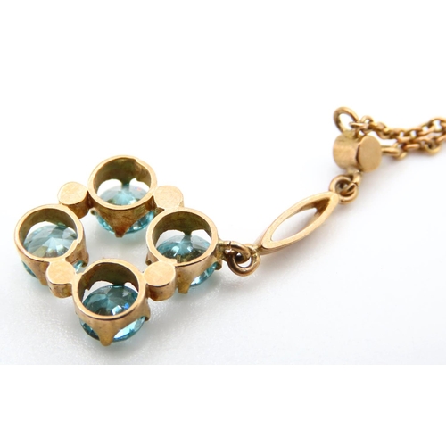 730 - 9 Carat Yellow Gold Blue Topaz Four Stone Set Pendant on 9 Carat Yellow Gold Chain