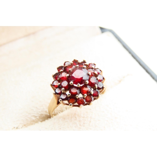 115 - Red Garnet Cluster Ring Starburst Form Mounted on 9 Carat Yellow Gold Band Ring Size O and a Half