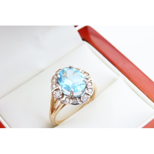 19 - Aquamarine and Diamond Cluster Ring Mounted on 9 Carat Yellow Gold Band Ring Size P