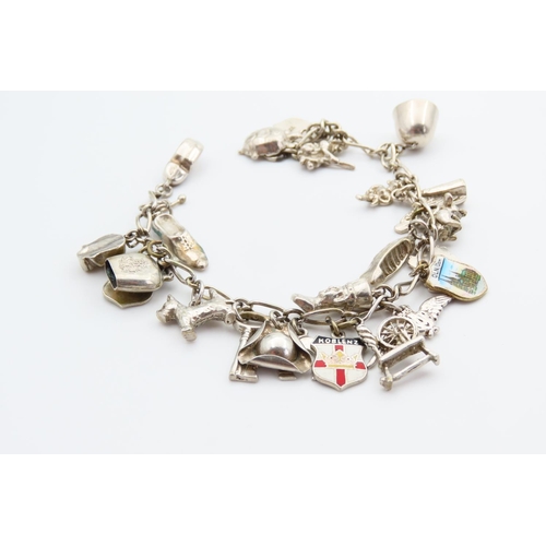 29 - Silver Charm Bracelet Adorned with Various Charms Including Hibernian Harp, Spinning Wheel, etc 20cm... 
