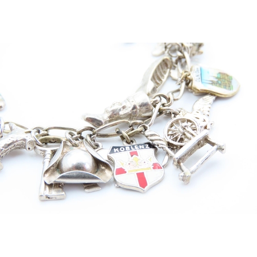 29 - Silver Charm Bracelet Adorned with Various Charms Including Hibernian Harp, Spinning Wheel, etc 20cm... 