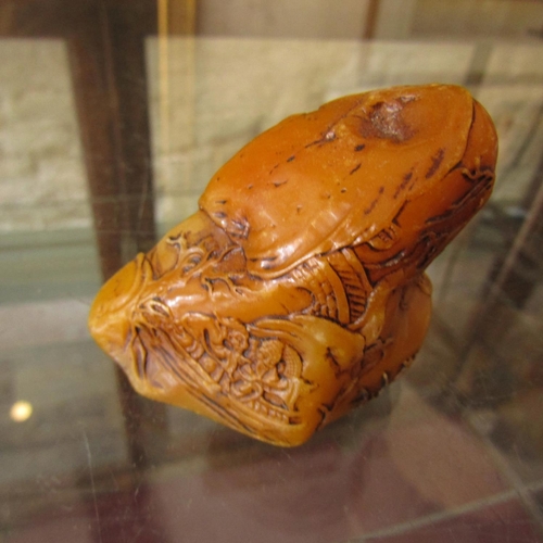 584 - Carved Amber Form Scroll Weight Approximately 6cm Wide