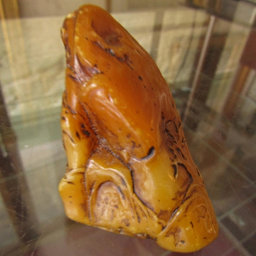 584 - Carved Amber Form Scroll Weight Approximately 6cm Wide