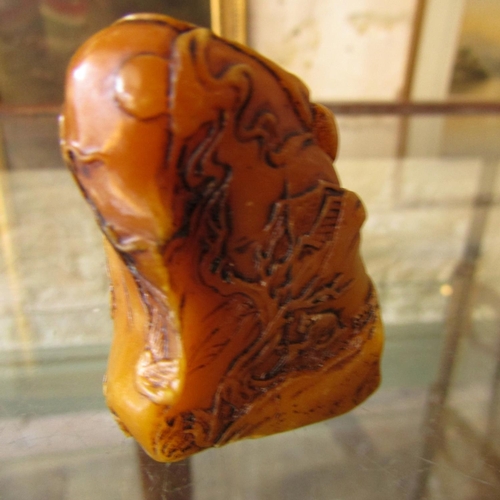 584 - Carved Amber Form Scroll Weight Approximately 6cm Wide