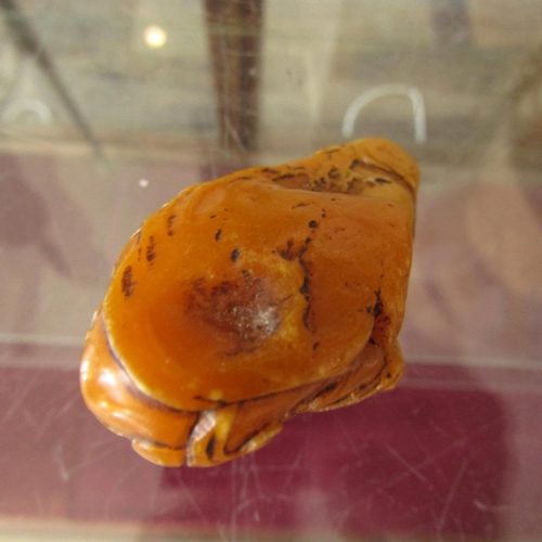 584 - Carved Amber Form Scroll Weight Approximately 6cm Wide