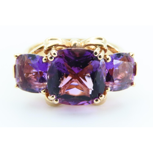 6 - Amethyst Three Stone Ring of Fine Hue Mounted on 9 Carat Yellow Gold Band Size P