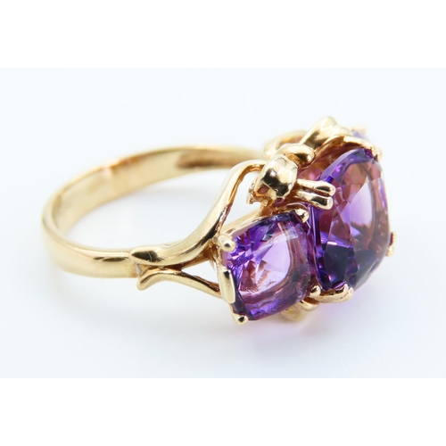 6 - Amethyst Three Stone Ring of Fine Hue Mounted on 9 Carat Yellow Gold Band Size P