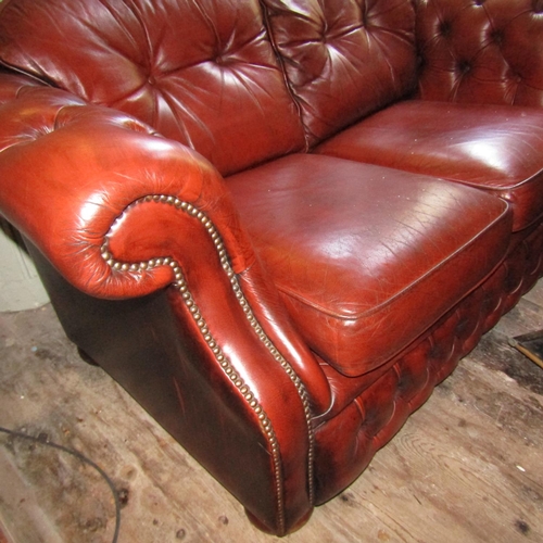 604 - Burgundy Leather Deep Button Upholstered Two Seater Chesterfield Settee Approximately 5ft 6 Inches W... 