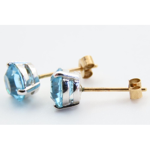 63 - Pair of 9 Carat Yellow Gold Bound Aquamarine Set Ladies Earrings