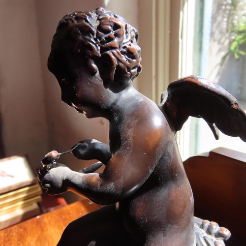 696 - Bronze Sculpture of Winged Cherub on Marble Oval Base Approximately 8 Inches High