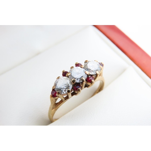 92 - Pale Sapphire and Ruby Set Three Stone Ring Mounted on 9 Carat Yellow Gold Band Ring Size L