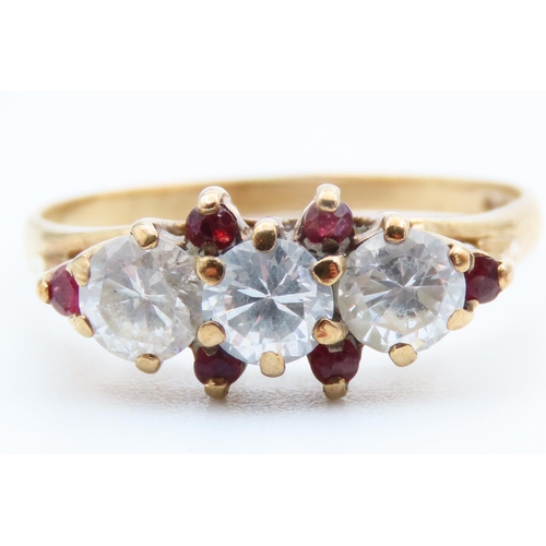 92 - Pale Sapphire and Ruby Set Three Stone Ring Mounted on 9 Carat Yellow Gold Band Ring Size L