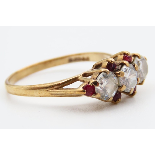 92 - Pale Sapphire and Ruby Set Three Stone Ring Mounted on 9 Carat Yellow Gold Band Ring Size L