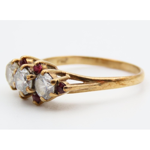 92 - Pale Sapphire and Ruby Set Three Stone Ring Mounted on 9 Carat Yellow Gold Band Ring Size L