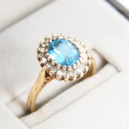 100 - Blue Topaz and Diamond Cluster Ring Mounted on 9 Carat Yellow Gold Band Ring Size L