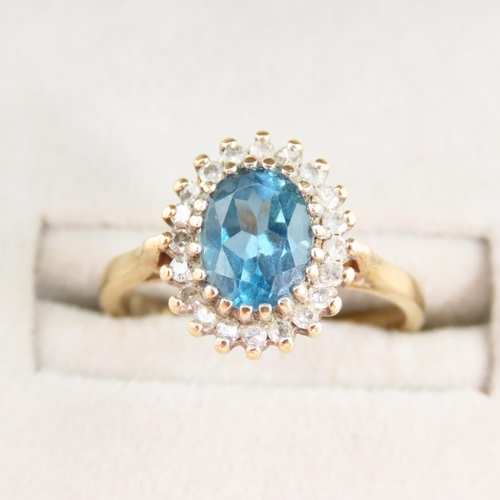 100 - Blue Topaz and Diamond Cluster Ring Mounted on 9 Carat Yellow Gold Band Ring Size L