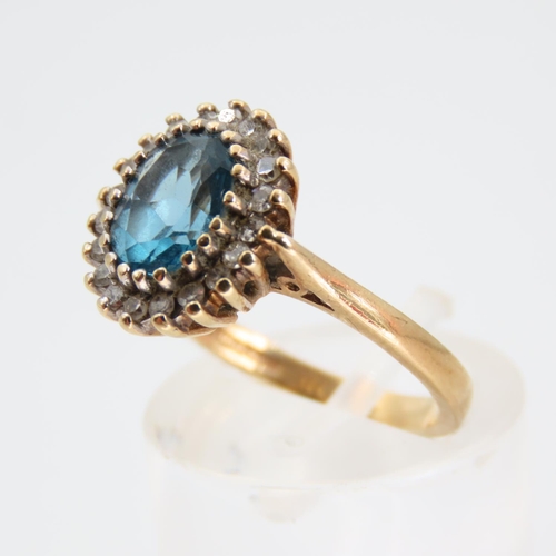 100 - Blue Topaz and Diamond Cluster Ring Mounted on 9 Carat Yellow Gold Band Ring Size L