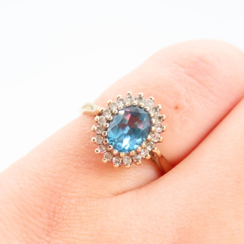 100 - Blue Topaz and Diamond Cluster Ring Mounted on 9 Carat Yellow Gold Band Ring Size L