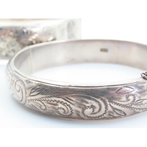 165 - Two Silver Ladies Wrist Bangles Hinge Form Incised Detailing to Both Inner Width 7cm Each