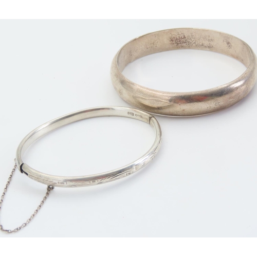 167 - Two Silver Bangles Hinge Form 7cm and 6.5cm Inner Diameter