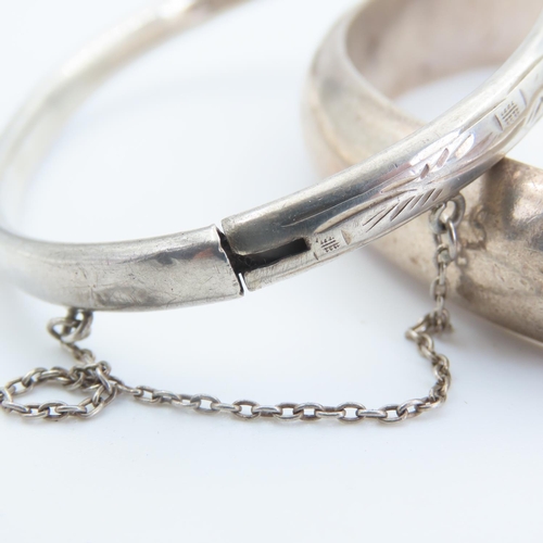 167 - Two Silver Bangles Hinge Form 7cm and 6.5cm Inner Diameter