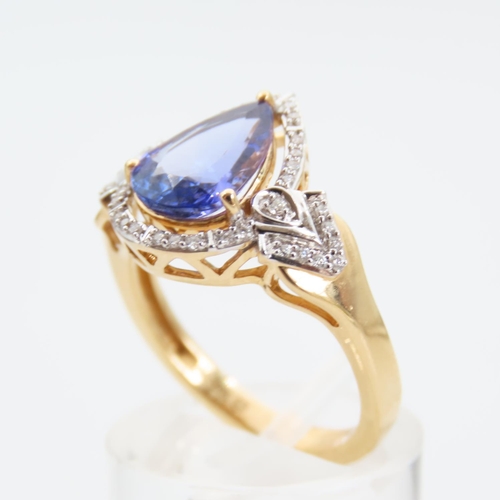 175 - Tanzanite Pear Cut Cluster Ring Halo Set with Diamonds Further Diamond Set Shoulders Mounted on 18 C... 