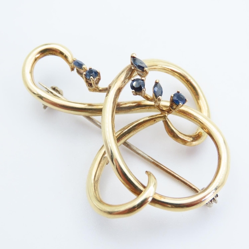 198 - 18 Carat Yellow Gold Six Stone Sapphire Set Ladies Brooch Shaped Form 5cm Wide x 4cm High