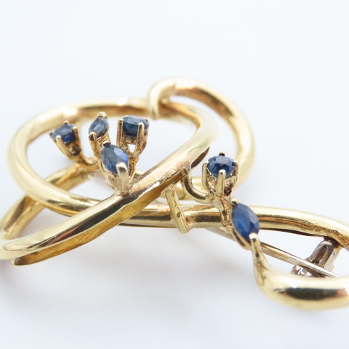 198 - 18 Carat Yellow Gold Six Stone Sapphire Set Ladies Brooch Shaped Form 5cm Wide x 4cm High