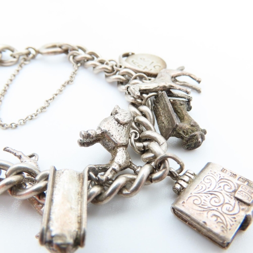 92 - Silver Charm Bracelet Laden with Various Silver Charms 16cm Long Charms Including Racing Car, Giraff... 