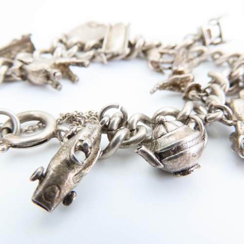 92 - Silver Charm Bracelet Laden with Various Silver Charms 16cm Long Charms Including Racing Car, Giraff... 