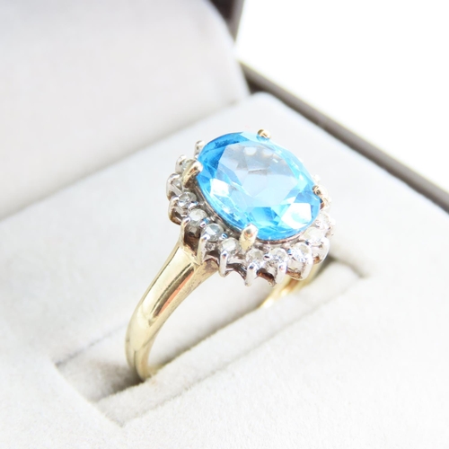 94 - Blue Topaz and Diamond Cluster Ring Mounted on 9 Carat Yellow Gold Band Ring Size N