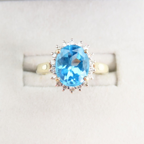 94 - Blue Topaz and Diamond Cluster Ring Mounted on 9 Carat Yellow Gold Band Ring Size N