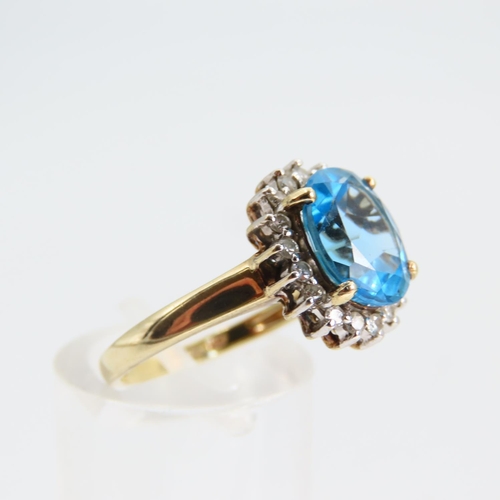 94 - Blue Topaz and Diamond Cluster Ring Mounted on 9 Carat Yellow Gold Band Ring Size N