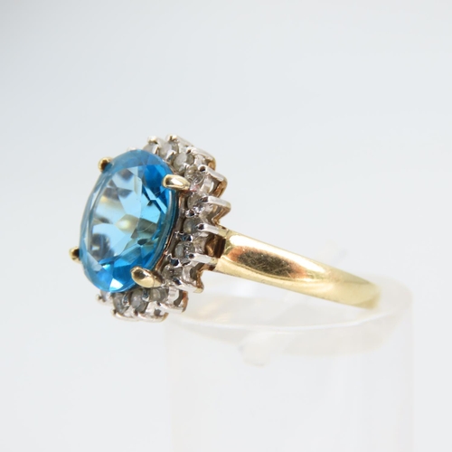 94 - Blue Topaz and Diamond Cluster Ring Mounted on 9 Carat Yellow Gold Band Ring Size N