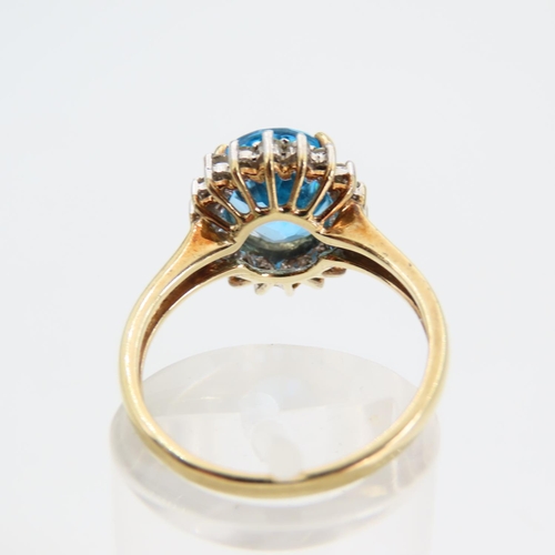 94 - Blue Topaz and Diamond Cluster Ring Mounted on 9 Carat Yellow Gold Band Ring Size N