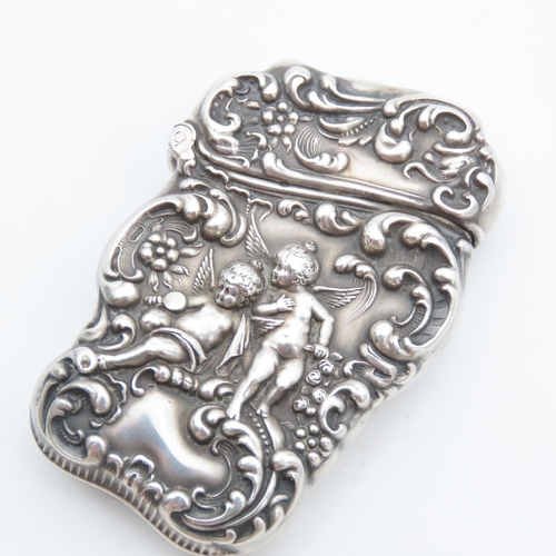 105 - Silver Vesta Case Cherub Motif Hinged Cover Striker Detailing to Base 7cm High x 4cm Wide