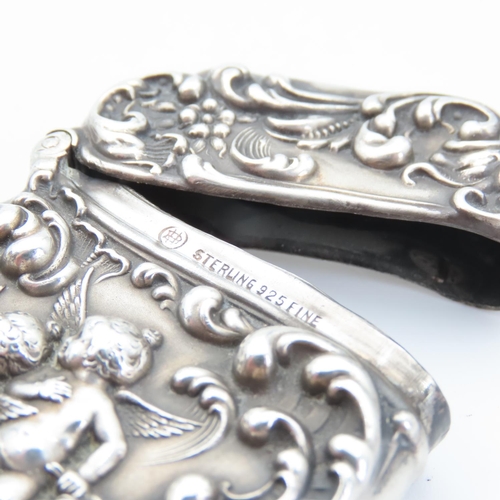 105 - Silver Vesta Case Cherub Motif Hinged Cover Striker Detailing to Base 7cm High x 4cm Wide