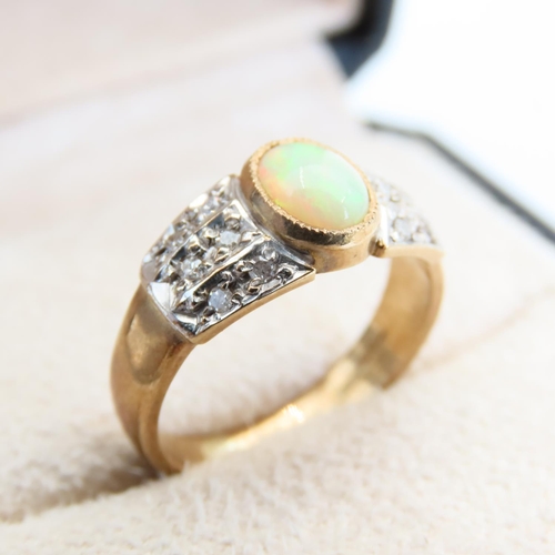 122 - Opal and Diamond Ring Mounted on 9 Carat Yellow Gold Band Size N